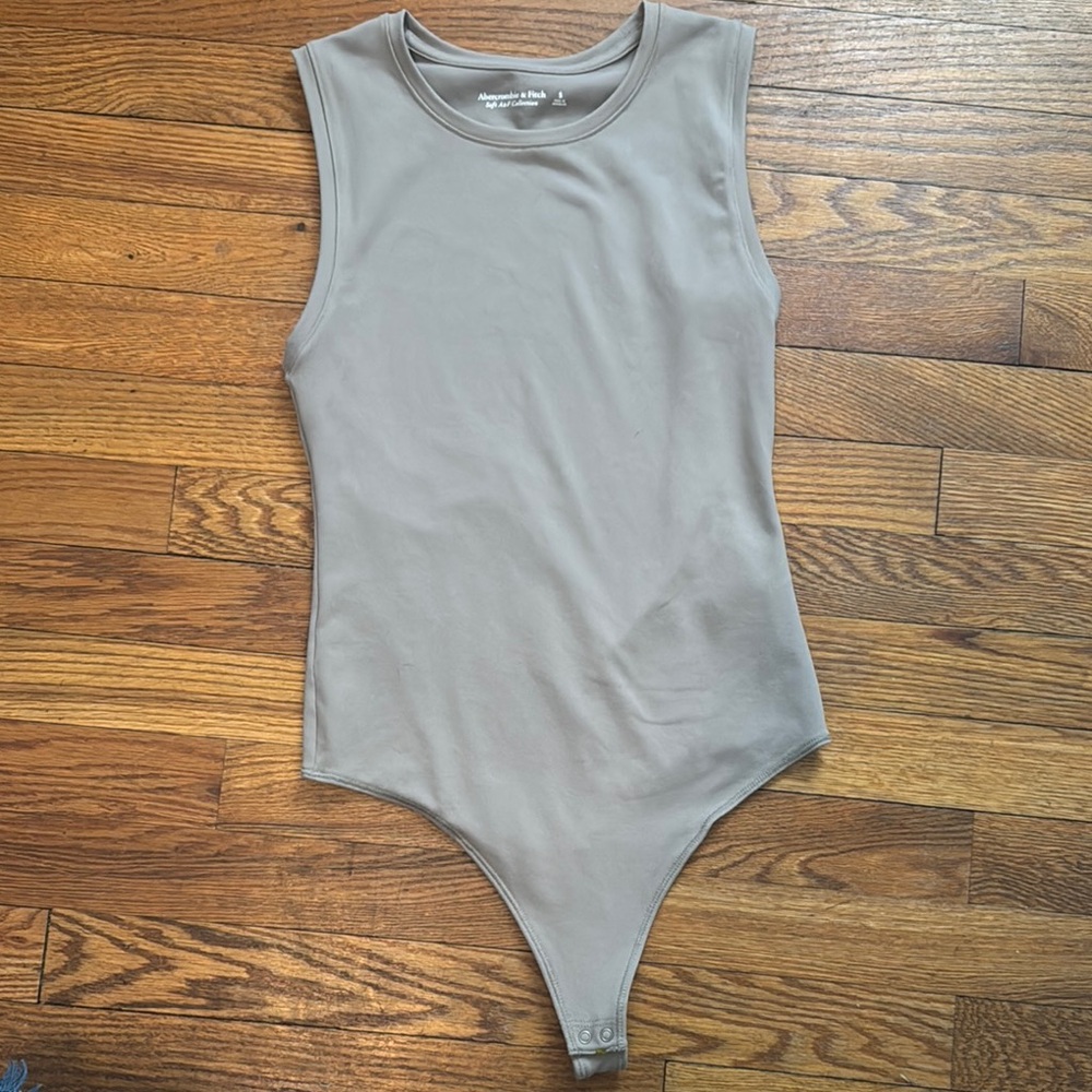 Abercrombie & Fitch “Soft A & F Collection” Sleeveless Bodysuit in Taupe.